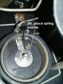 Place spring washer